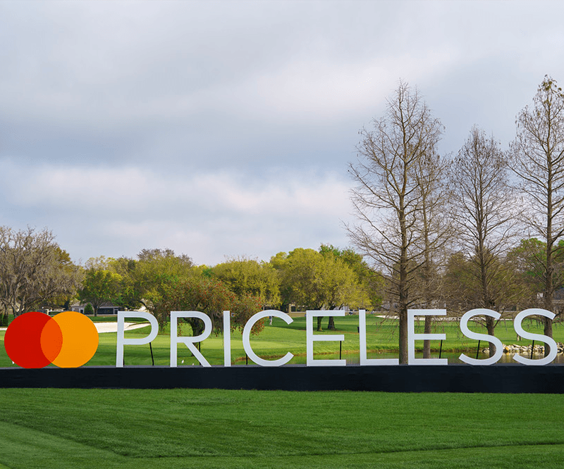 A sign of the Mastercard Logo and the word Priceless on the course